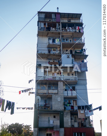 Old courtyards. Streets of Batumi. Old Soviet architecture. Clothes hanging on ropes. Vintage atmosphere of courtyards. Tuhiu streets. 117034480