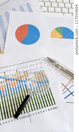 Graph and magnifying glass Data analysis Business Banner material Vertical position Graph and magnifying glass Data analysis Business Banner material Vertical position 117034604
