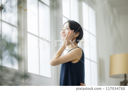 A woman who feels moisturized A woman who feels moisturized 117034788
