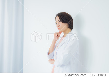 A woman in a white coat A woman in a white coat 117034831