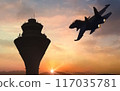 fighter jet flyby near airbase communication tower at sunrise 117035781