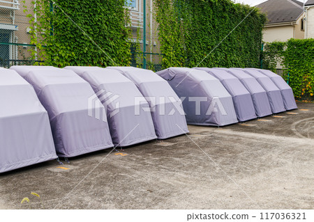 Motorcycle covers in motorcycle parking areas 117036321
