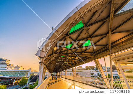 Fujisawa cityscape in Japan in July. View of Tsujido Station on the Tokaido Main Line, trains, and the orange and green Shonan colors of the line = 21st Fujisawa cityscape in Japan in July. View of Tsujido Station on the Tokaido Main Line, trains, and the orange and green Shonan colors of the line = 21st 117039316