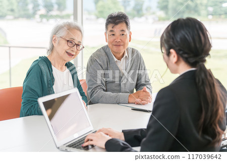 Senior couple consulting and meeting with a social worker, support counselor, life counselor, or social worker Senior couple consulting and meeting with a social worker, support counselor, life counselor, or social worker 117039642