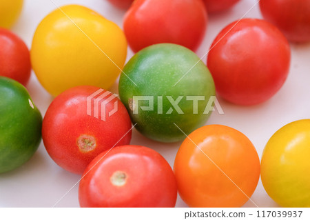 Colorful cherry tomatoes on a white plate Colorful cherry tomatoes on a white plate 117039937