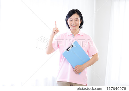 Portrait of a caregiver wearing a pink polo shirt 117040976