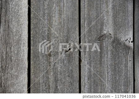 Weathered wooden surface with significant cracking and crevices 117041036