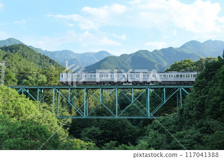 Chichibu Railway train running through the mountains of Chichibu Chichibu Railway train running through the mountains of Chichibu 117041388