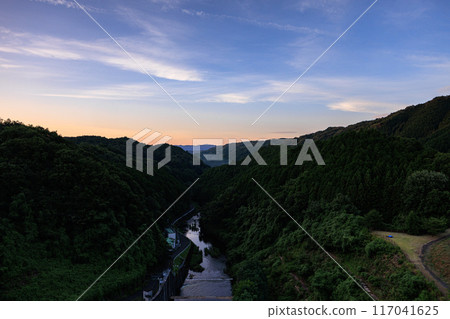 Scenery of Nunome Dam on the eastern edge of Nara City. Evening sky on the valley side and Nunome River. Fixed tripod interval photography from before sunset to the night sky. Scenery of Nunome Dam on the eastern edge of Nara City. Evening sky on the valley side and Nunome River. Fixed tripod interval photography from before sunset to the night sky. 117041625