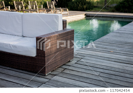 Contemporary poolside furniture in hotel Contemporary poolside furniture in hotel 117042454