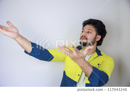 Man with surprised and incomprehensible expression Man with surprised and incomprehensible expression 117043248