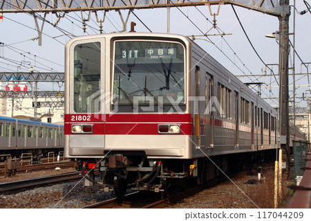 Tokyo Metro Hibiya Line direct 20000 series train passing in front of Kasukabe Station 117044209