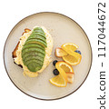 Avocado Toast with Scrambled Eggs and Fruit. 117044672