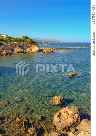 clear seawater at La Buena beach in El Perello, Spain clear seawater at La Buena beach in El Perello, Spain 117045425