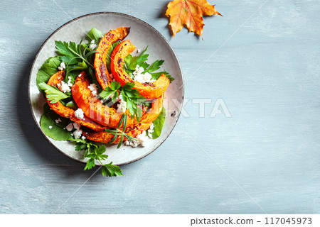 Autumn salad with grilled pumpkin, feta cheese 117045973