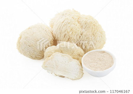 A collection of lion's mane mushrooms including whole and sliced pieces 117046167