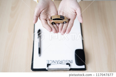 Dealers that work on auto loans or leases make it easier to buy or lease a car from the company. Car loan and car insurance concept Dealers that work on auto loans or leases make it easier to buy or lease a car from the company. Car loan and car insurance concept 117047877