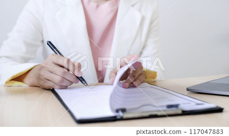 Business woman employer holding resume hiring recruit looking cv resume to hire candidates, analyzing information before job interview. Recruitment concepts 117047883