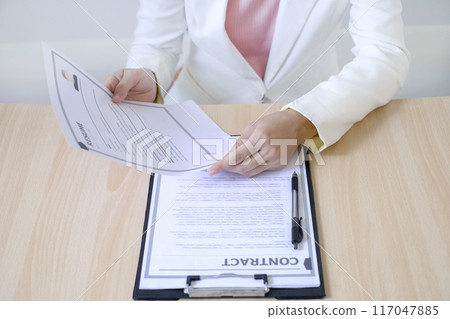 Business woman employer holding resume hiring recruit looking cv resume to hire candidates, analyzing information before job interview. Recruitment concepts Business woman employer holding resume hiring recruit looking cv resume to hire candidates, analyzing information before job interview. Recruitment concepts 117047885