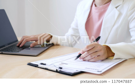 Business woman employer holding resume hiring recruit looking cv resume to hire candidates, analyzing information before job interview. Recruitment concepts Business woman employer holding resume hiring recruit looking cv resume to hire candidates, analyzing information before job interview. Recruitment concepts 117047887