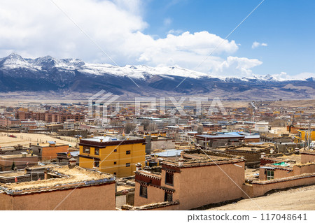 Elevated cityscape view of Litang old town in Ganzi Tibetan autonomous region, with scenic mountains in the background Elevated cityscape view of Litang old town in Ganzi Tibetan autonomous region, with scenic mountains in the background 117048641