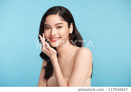 Beautiful Young transgender woman with clean fresh skin on blue background, Face care, Facial treatment, Cosmetology, beauty and spa, transgender women portrait. Beautiful Young transgender woman with clean fresh skin on blue background, Face care, Facial treatment, Cosmetology, beauty and spa, transgender women portrait. 117049847
