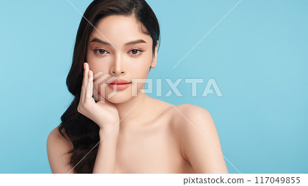 Beautiful Young transgender woman with clean fresh skin on blue background, Face care, Facial treatment, Cosmetology, beauty and spa, transgender women portrait. Beautiful Young transgender woman with clean fresh skin on blue background, Face care, Facial treatment, Cosmetology, beauty and spa, transgender women portrait. 117049855