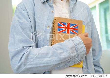 Learn English language, Asian teenage student hold book with flag in course at school. Learn English language, Asian teenage student hold book with flag in course at school. 117050094