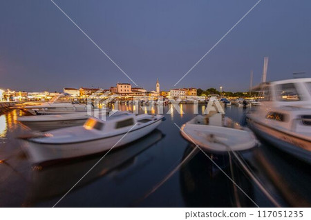 Picture over the harbor of Fazana in Istria in the evening during sunset Picture over the harbor of Fazana in Istria in the evening during sunset 117051235