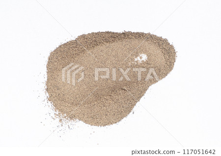 Smear of ground black pepper on white background isolate, creativity in cooking, spice texture. Smear of ground black pepper on white background isolate, creativity in cooking, spice texture. 117051642