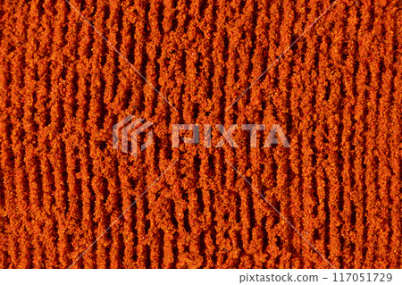 Ground paprika, red terracotta spice background, art in cooking. Ground paprika, red terracotta spice background, art in cooking. 117051729