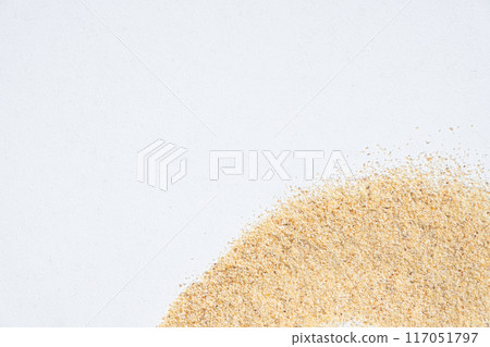 Scattered garlic powder on white background, garlic spice pattern and texture top view 117051797
