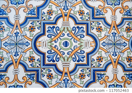 ceramic tile with a traditional Uzbek ornament with a pattern. The wall of white mosque Minor in Uzbekistan 117052463
