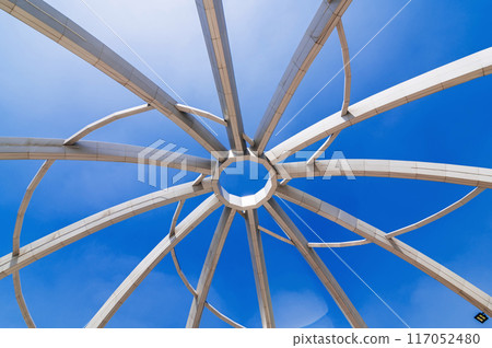 Metal construction of art object on background of blue sky background. Amphitheater in Navruz Park in Tashkent, Uzbekistan Metal construction of art object on background of blue sky background. Amphitheater in Navruz Park in Tashkent, Uzbekistan 117052480