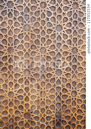 arabic Uzbek Islamic patterns ornament with stars on modern wooden carved door in Uzbekistan arabic Uzbek Islamic patterns ornament with stars on modern wooden carved door in Uzbekistan 117052534