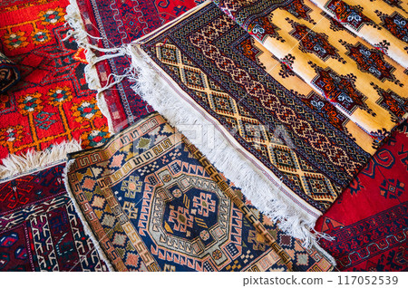 oriental asian Uzbek carpets at bazaar in Uzbekistan in Samarkand 117052539