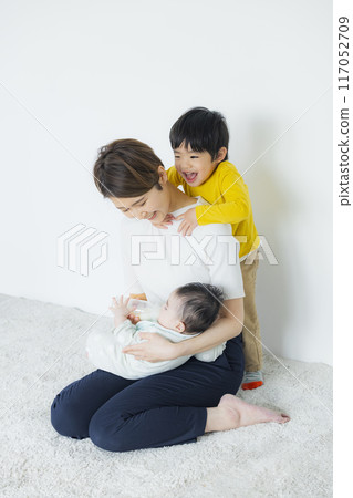A mother playing with her children A mother playing with her children 117052709