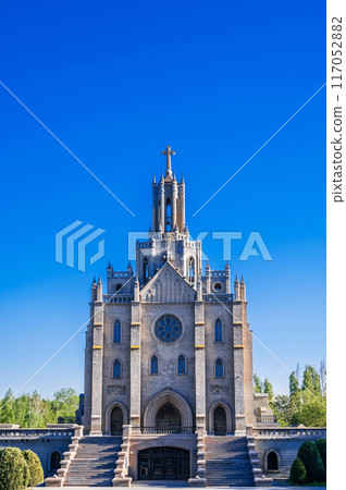 Cathedral of Sacred Heart of Jesus at summer day. Ancient polish Roman Catholic Church in gothic style in Tashkent in Uzbekistan Cathedral of Sacred Heart of Jesus at summer day. Ancient polish Roman Catholic Church in gothic style in Tashkent in Uzbekistan 117052882