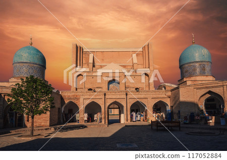 ancient Islamic madrasah Barakhan in Tashkent in Uzbekistan. Architectural complex Hazrati Imam in summer at sunset ancient Islamic madrasah Barakhan in Tashkent in Uzbekistan. Architectural complex Hazrati Imam in summer at sunset 117052884