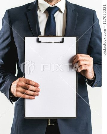 A man in a suit holding a clipboard with a white page 117053321