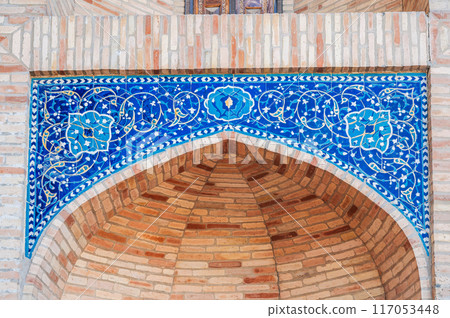 ancient ceramic tile with traditional Arabic pattern Uzbek ornament decorates the wall portal of old islamic Barakhan Madrasah in Uzbekistan ancient ceramic tile with traditional Arabic pattern Uzbek ornament decorates the wall portal of old islamic Barakhan Madrasah in Uzbekistan 117053448