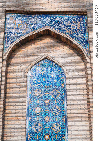 ancient ceramic tile with traditional Uzbek ornament Islamic pattern on wall of old Muslim mosque Hazrati Imam in Uzbekistan in Tashkent ancient ceramic tile with traditional Uzbek ornament Islamic pattern on wall of old Muslim mosque Hazrati Imam in Uzbekistan in Tashkent 117053457