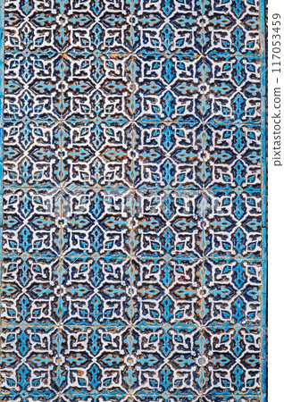 wall of ancient Muslim mosque Hazrati Imam is decorated with ceramic tiles with vintage Uzbek ornament Islamic pattern in Uzbekistan wall of ancient Muslim mosque Hazrati Imam is decorated with ceramic tiles with vintage Uzbek ornament Islamic pattern in Uzbekistan 117053459