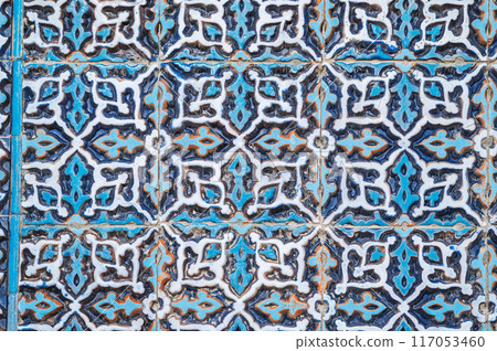 old wall of Muslim mosque Hazrati Imam is decorated with ceramic tiles with traditional oriental Uzbek ornament and Islamic pattern 117053460