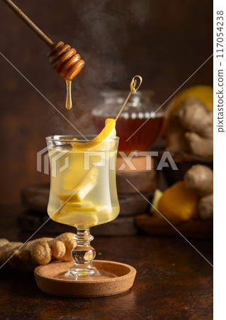 Ginger tea with lemon and honey. 117054238