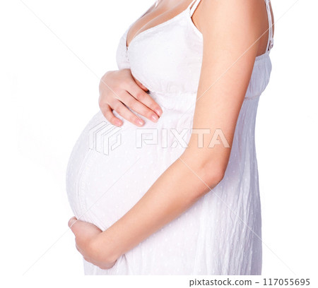 pregnant woman in a white dress pregnant woman in a white dress 117055695