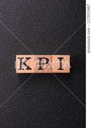 Inscription KPI Key Performance Indicator with wooden cubes 117055967