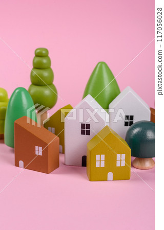 Wooden toy house as a conceptual background for purchasing real estate Wooden toy house as a conceptual background for purchasing real estate 117056028