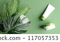 3D Illustration Monstera, Tropical leaves, plants on light green background. Summer cosmetic arrangement. Concept for beauty product presentation, luxury organic cosmetic, skin care. 3D render top 117057353