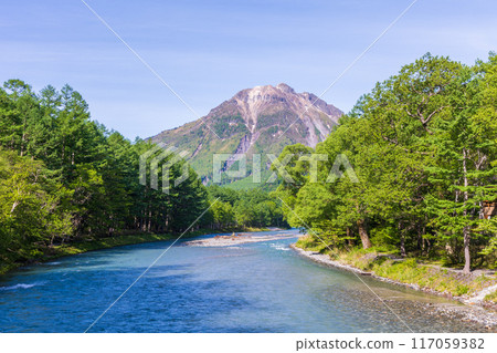 One of Japan's leading mountain resorts: Kamikochi with its fresh greenery - view from Kappa Bridge One of Japan's leading mountain resorts: Kamikochi with its fresh greenery - view from Kappa Bridge 117059382